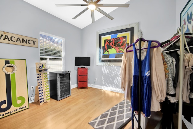 interior space featuring hardwood / wood-style floors, wine cooler, vaulted ceiling, and ceiling fan