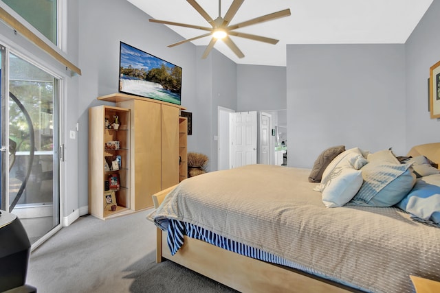 carpeted bedroom with high vaulted ceiling and ceiling fan