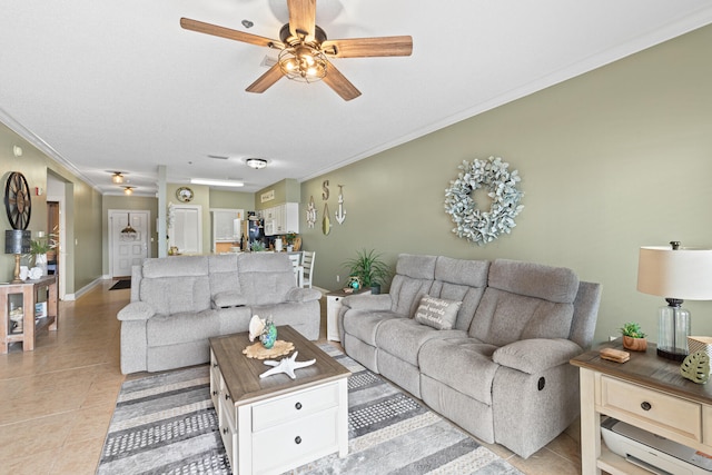 tiled living room featuring ceiling fan and crown molding