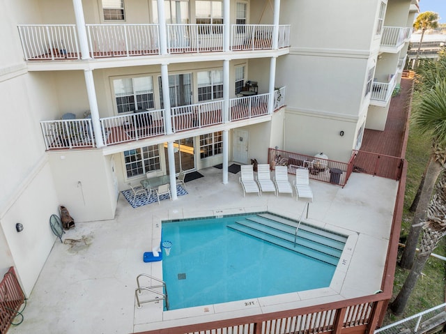 view of pool featuring a patio