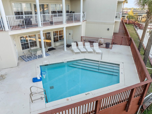 view of pool featuring a patio