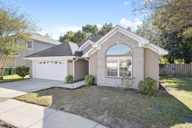 view of front facade with a garage and a front yard