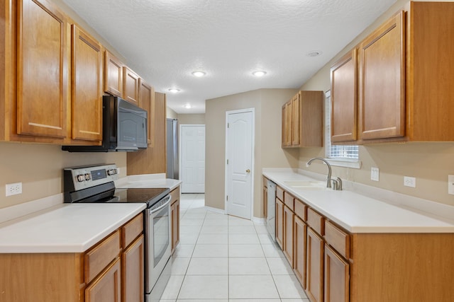 kitchen with a textured ceiling, dishwasher, light tile patterned flooring, and stainless steel electric range