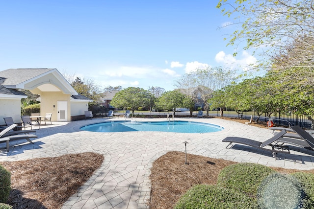 view of swimming pool with a patio area