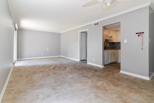 unfurnished room featuring ceiling fan, sink, and crown molding