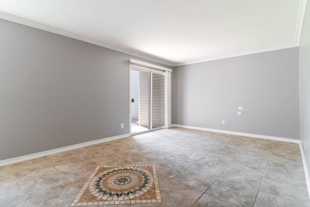 empty room featuring ornamental molding and a textured ceiling