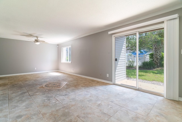 unfurnished room featuring ceiling fan, a textured ceiling, and ornamental molding