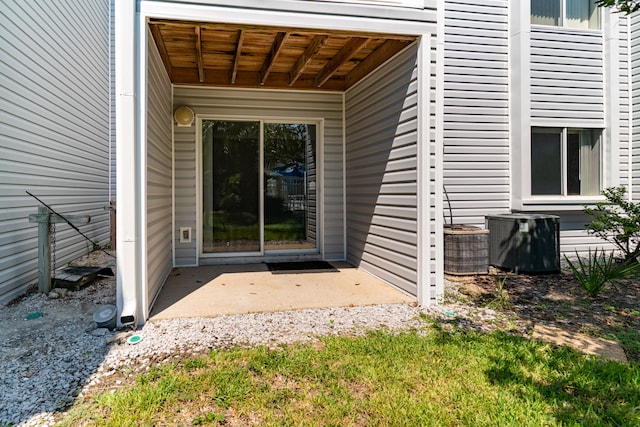 property entrance featuring central AC unit