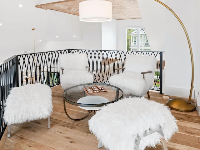 living area featuring light hardwood / wood-style flooring and lofted ceiling