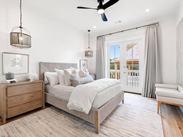 bedroom featuring access to exterior, french doors, light hardwood / wood-style flooring, and ceiling fan