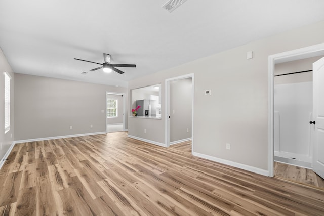 interior space featuring ceiling fan and light wood-type flooring