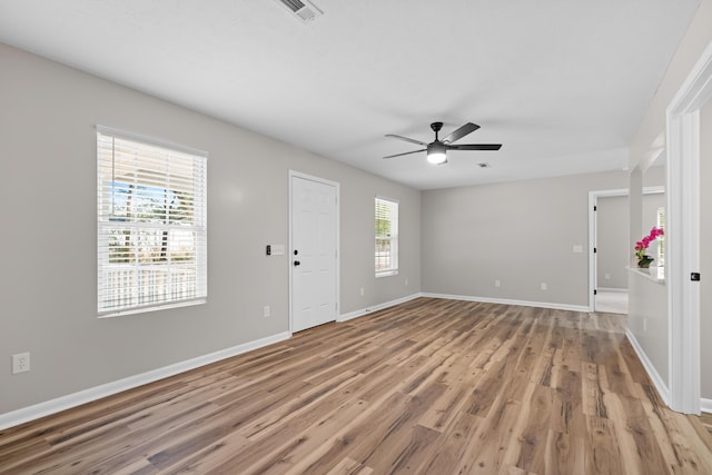 interior space featuring ceiling fan, a healthy amount of sunlight, and light wood-type flooring