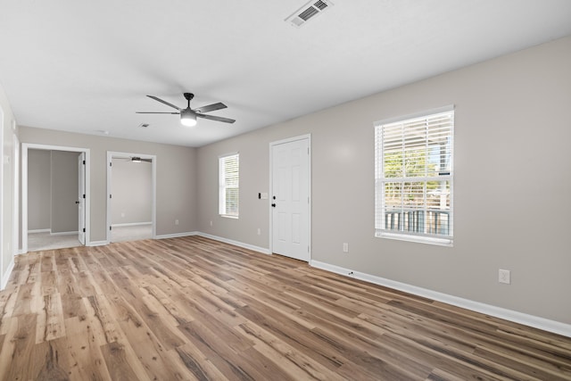 unfurnished room featuring ceiling fan and light wood-type flooring