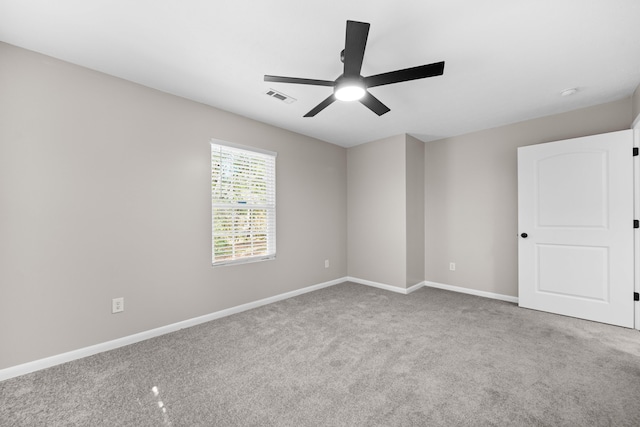 carpeted empty room with ceiling fan