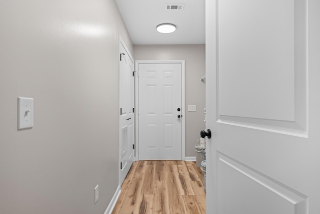 doorway with light wood-type flooring