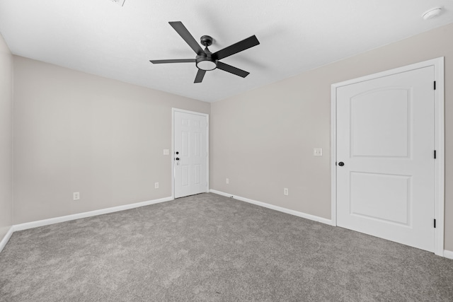 empty room with carpet flooring and ceiling fan