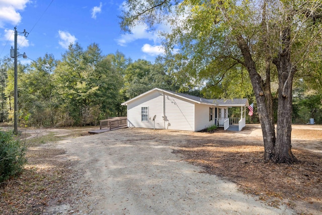 view of side of property featuring a porch