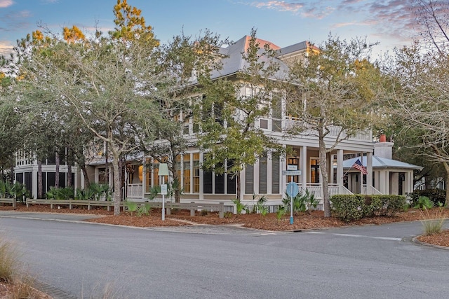 view of front of house with a balcony