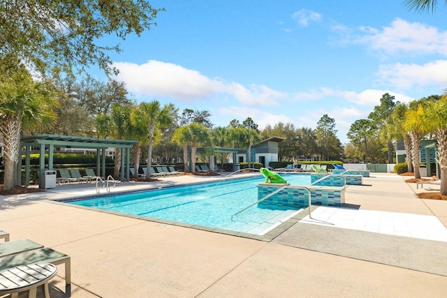 view of swimming pool featuring a pergola and a patio