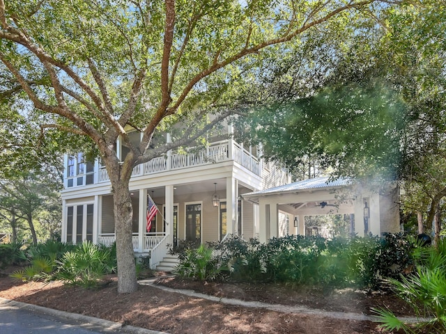 11 Acorn Way, Santa Rosa Beach, FL 32459 - view of property hidden behind natural elements with a balcony, covered porch, metal roof, and a gazebo