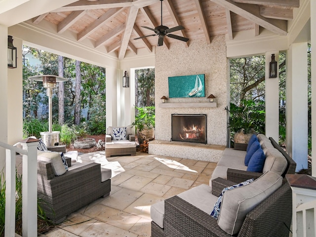 view of patio / terrace with a gazebo, ceiling fan, and an outdoor fireplace