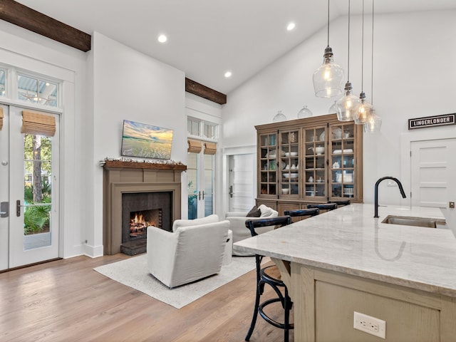11 Acorn Way, Santa Rosa Beach, FL 32459 - living area featuring high vaulted ceiling, a lit fireplace, light wood-style floors, and recessed lighting