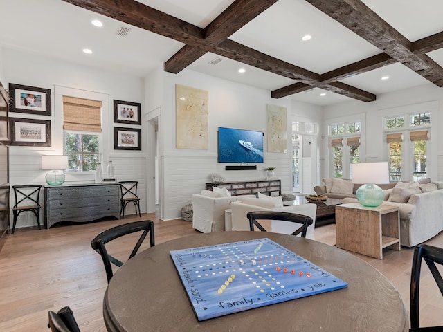 living room featuring beam ceiling, light hardwood / wood-style flooring, and coffered ceiling