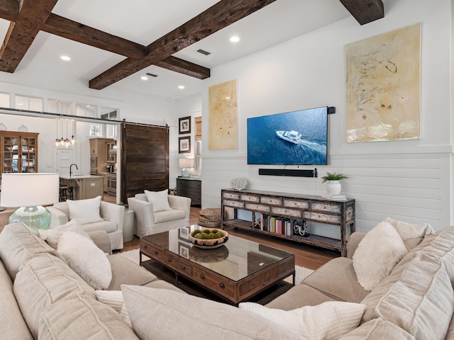 11 Acorn Way, Santa Rosa Beach, FL 32459 - living area with wood finished floors, a barn door, beamed ceiling, recessed lighting, and coffered ceiling