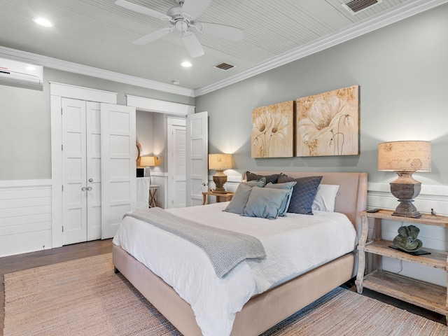 bedroom with wood-type flooring, a closet, ceiling fan, and ornamental molding