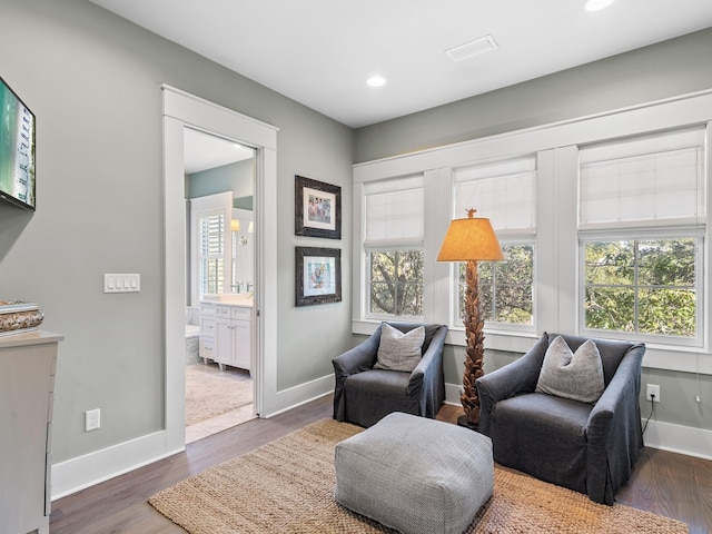 sitting room with dark hardwood / wood-style floors