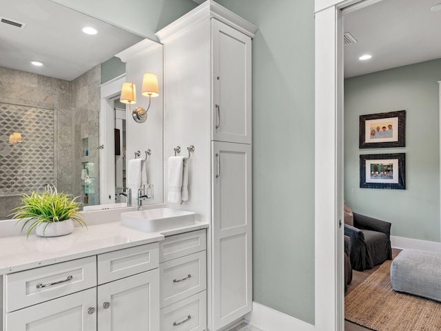 bathroom with vanity and walk in shower