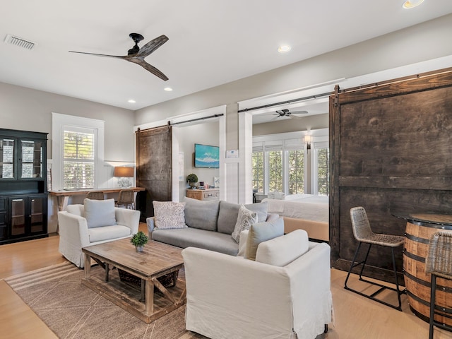 11 Acorn Way, Santa Rosa Beach, FL 32459 - living area with a barn door, ceiling fan, light wood-style flooring, and recessed lighting