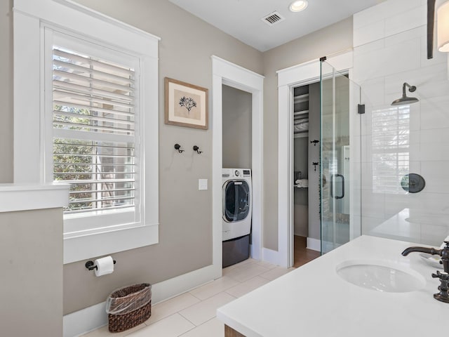 11 Acorn Way, Santa Rosa Beach, FL 32459 - full bath featuring tile patterned flooring, a shower stall, washer / dryer, vanity, and baseboards