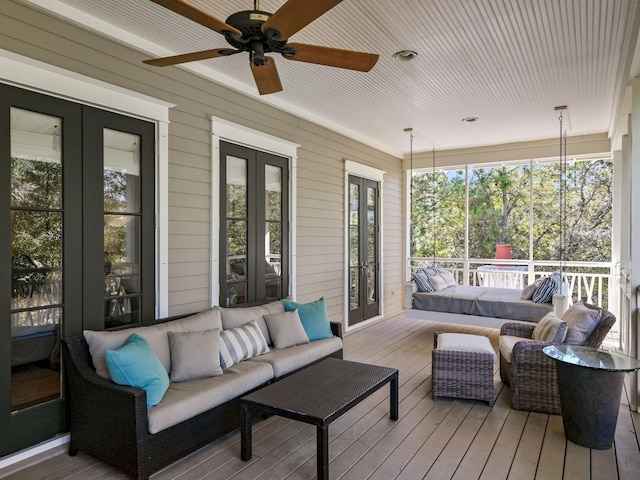 wooden terrace featuring outdoor lounge area and french doors