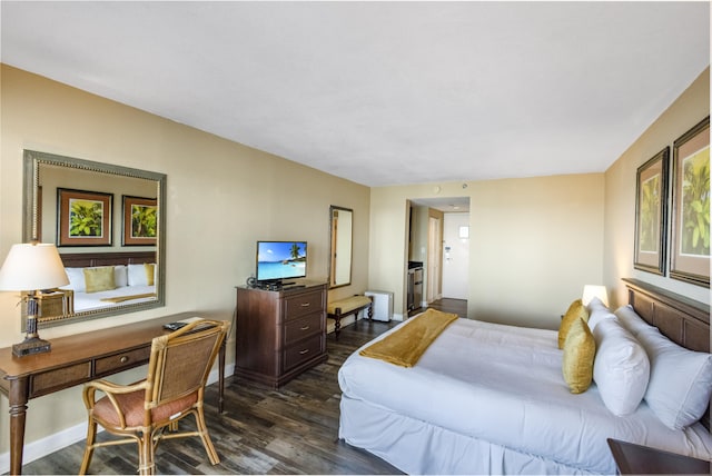 bedroom featuring dark hardwood / wood-style floors