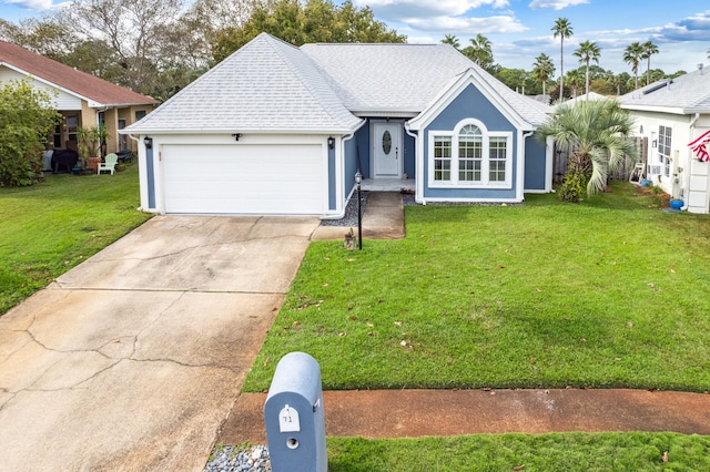 ranch-style house featuring a garage and a front lawn