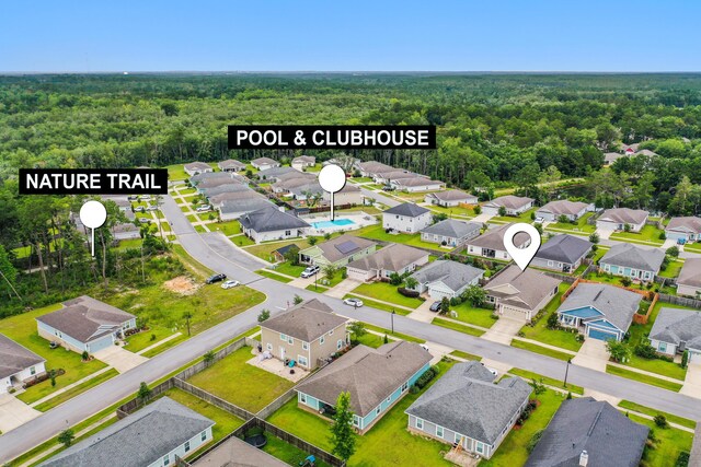 727 Marquis Way, Freeport, FL 32439 - aerial view of residential area with a forest
