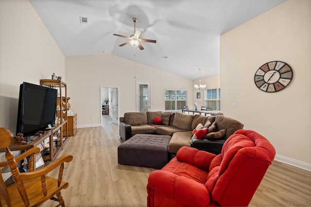 727 Marquis Way, Freeport, FL 32439 - living room with baseboards, light wood-type flooring, a ceiling fan, a chandelier, and lofted ceiling