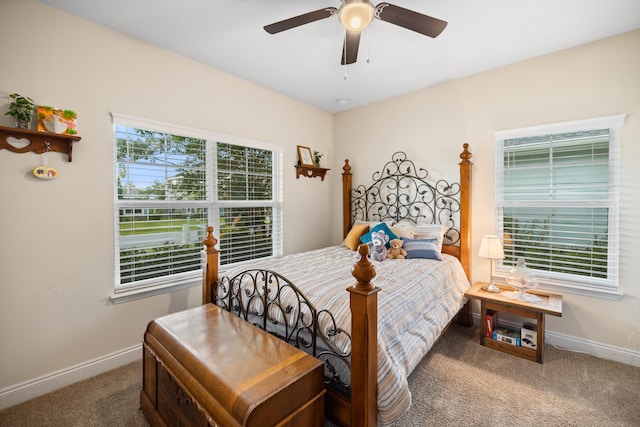 carpeted bedroom featuring ceiling fan