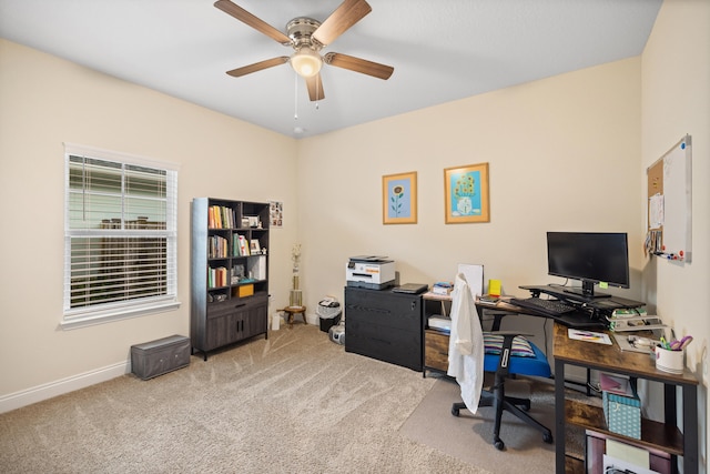 office area with ceiling fan and light colored carpet