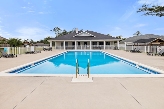 727 Marquis Way, Freeport, FL 32439 - community pool with fence and a patio area
