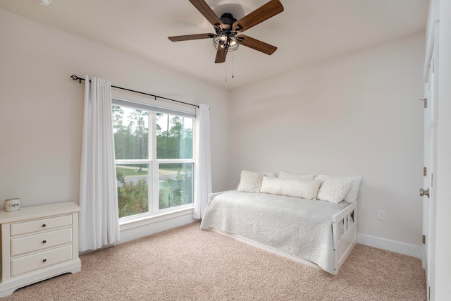 carpeted bedroom with ceiling fan