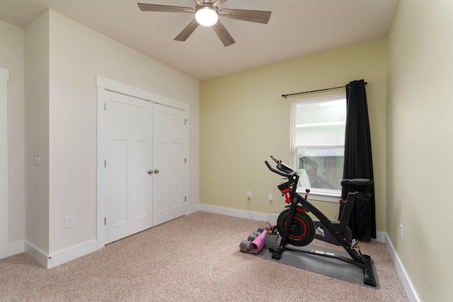 workout room featuring light colored carpet and ceiling fan