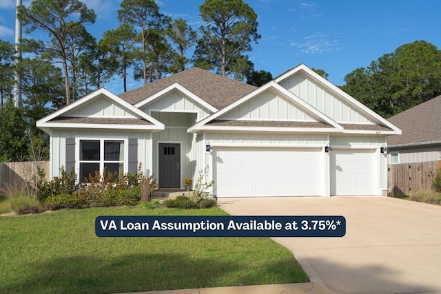 view of front of home featuring a garage and a front yard