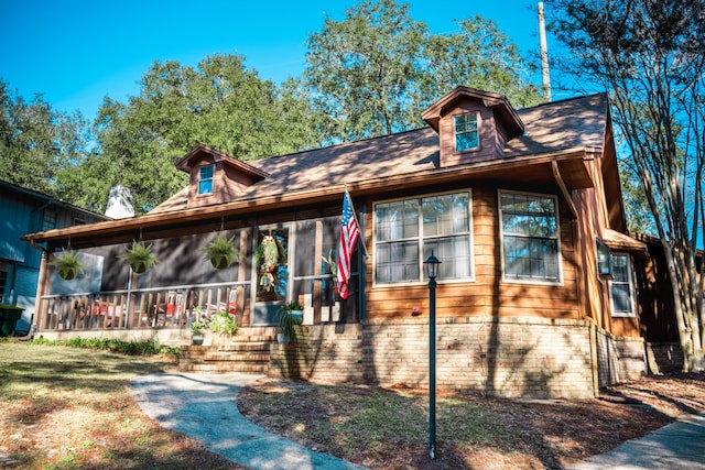 view of front of property with a sunroom