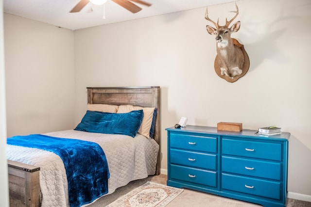 bedroom with light colored carpet and ceiling fan