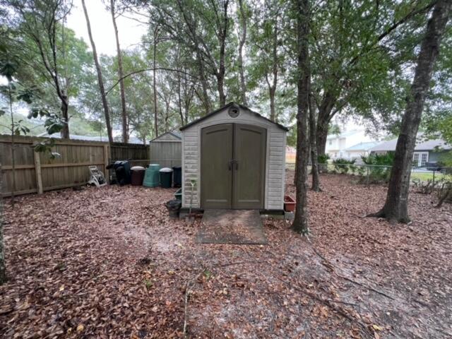 view of shed with a fenced backyard