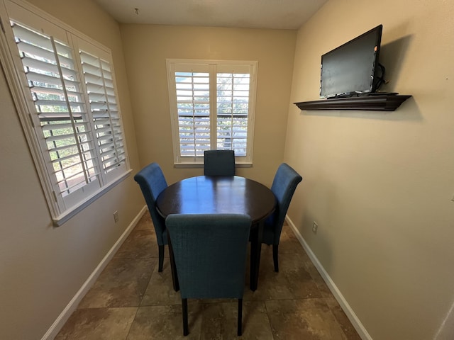 dining area featuring baseboards