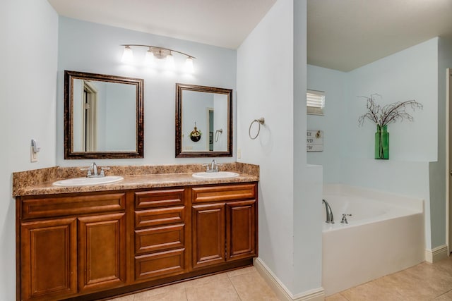 bathroom with tile patterned flooring, vanity, and a bathtub