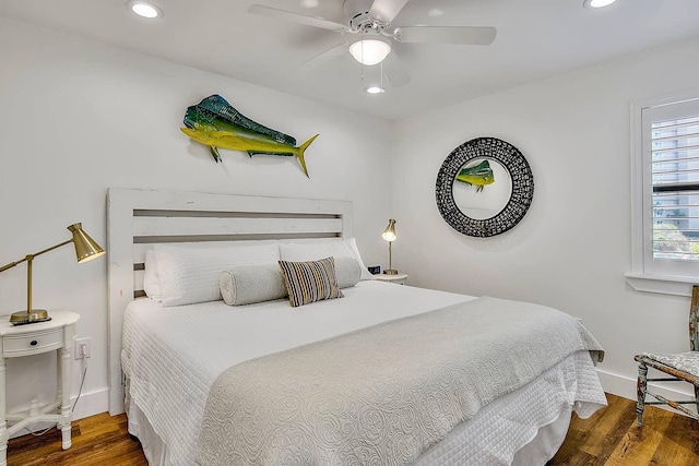 bedroom with ceiling fan and dark wood-type flooring